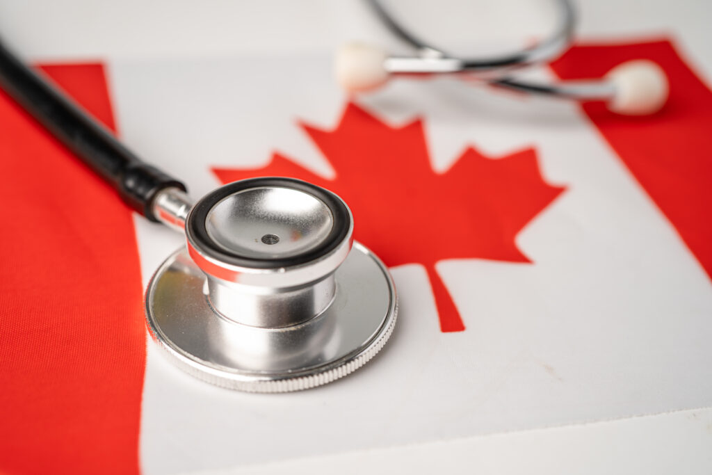 Black stethoscope on Canada flag background